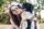 young woman cuddling a dog