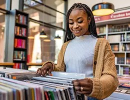 young woman shopping for records