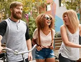 group of young adults walking through the city