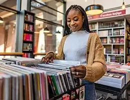 young woman shopping for records
